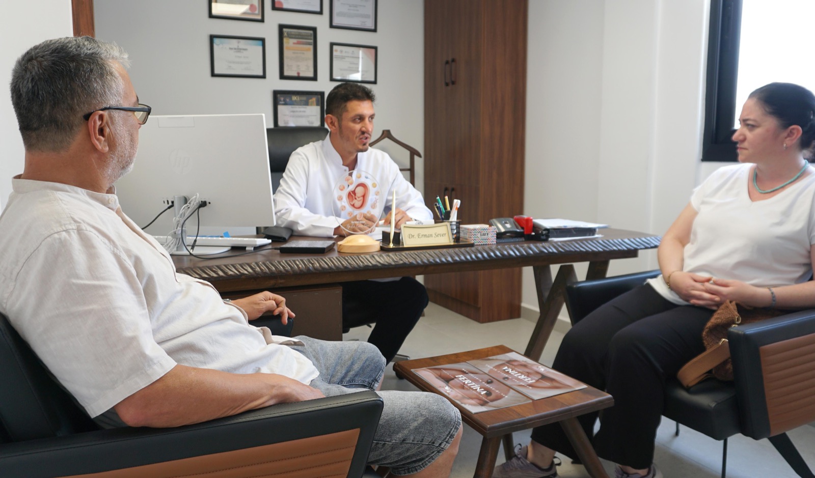 Dr. Erman Sever in consultation with a couple at Fertina IVF